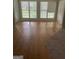 A sunroom with wood floors and many large windows at 4887 Winterview Ln, Douglasville, GA 30135