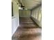 Bright sunroom featuring stone floors, lots of windows and ceiling fans at 4887 Winterview Ln, Douglasville, GA 30135