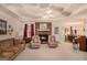 Cozy living room features a brick fireplace, soft carpet, and access to the dining area at 161 Bradford Pl, Stockbridge, GA 30281