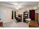 This office room includes a ceiling fan, a work desk, and a brown wooden bookshelf for all of your office needs at 161 Bradford Pl, Stockbridge, GA 30281