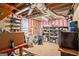 The unfinished basement has an exposed ceiling and walls, storage racks, and exposed ductwork at 161 Bradford Pl, Stockbridge, GA 30281