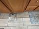Bathroom floor with light-colored tile, a scale, and a small rug at 180 Cooper Rd, Social Circle, GA 30025