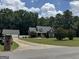 Charming two-story home with well-manicured lawn and mature trees, providing excellent curb appeal at 180 Cooper Rd, Social Circle, GA 30025