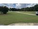 Expansive front lawn with mature trees and a long driveway leading to the home at 180 Cooper Rd, Social Circle, GA 30025