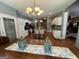 Open kitchen concept with granite countertops, stainless appliances, and an island at 180 Cooper Rd, Social Circle, GA 30025