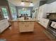 Kitchen with a granite island, stainless steel appliances, and eat in kitchen at 180 Cooper Rd, Social Circle, GA 30025