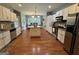 Spacious kitchen featuring stainless steel appliances, white cabinetry, and a center island at 180 Cooper Rd, Social Circle, GA 30025