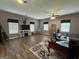 Spacious living room with hardwood floors and lots of natural light from several windows at 180 Cooper Rd, Social Circle, GA 30025