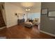 Inviting living room with hardwood floors, shiplap walls and stairs nearby at 180 Cooper Rd, Social Circle, GA 30025