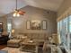 Inviting living room with neutral tones, large windows, and a comfortable seating arrangement at 180 Cooper Rd, Social Circle, GA 30025