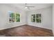 Bedroom featuring hardwood floors and windows offering views of the outdoors at 301 Retreat Way, Carrollton, GA 30116