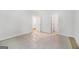 Bedroom with light-colored walls, carpet flooring, and multiple doorways at 301 Retreat Way, Carrollton, GA 30116