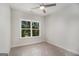 Bedroom with a ceiling fan and a view of the trees at 301 Retreat Way, Carrollton, GA 30116