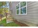 Exterior view of house with a side entrance door and steps plus large window at 301 Retreat Way, Carrollton, GA 30116