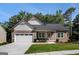 Charming single-story house features a well-maintained lawn, attached garage, and inviting front porch with craftsman details at 301 Retreat Way, Carrollton, GA 30116