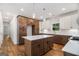 Kitchen island with cabinets and a white countertop, stainless steel appliances at 301 Retreat Way, Carrollton, GA 30116