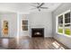 Bright living area featuring wood floors, a modern fireplace, and lots of light at 301 Retreat Way, Carrollton, GA 30116