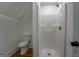 Compact bathroom featuring a shower and toilet, ideal for maximizing space at 5106 N Pratt St, Covington, GA 30014
