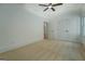 Well-lit bedroom with carpet, ceiling fan, double closets, and a window at 5106 N Pratt St, Covington, GA 30014