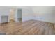 Bonus room with light wood floors, white walls, door to the bathroom, and natural light at 5106 N Pratt St, Covington, GA 30014