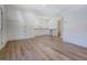 Bonus room with light wood floors, white walls, door to the bathroom, and natural light at 5106 N Pratt St, Covington, GA 30014