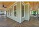Long covered porch with tongue and groove wood ceiling at 5106 N Pratt St, Covington, GA 30014