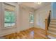Bright foyer with hardwood floors and stairs to upper level at 5106 N Pratt St, Covington, GA 30014