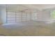 Spacious garage with a concrete floor and windows that provide natural light at 5106 N Pratt St, Covington, GA 30014