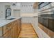 Kitchen features an island with sink and dishwasher, stainless appliances, and lots of storage at 5106 N Pratt St, Covington, GA 30014