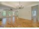 Bright living room with large windows, hardwood floors, and views into the kitchen at 5106 N Pratt St, Covington, GA 30014