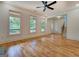 Bright living room featuring hardwood floors, large windows, and views of the outdoor scenery at 5106 N Pratt St, Covington, GA 30014
