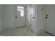 Mudroom with tile floor and a door with glass panel; lots of natural light at 5106 N Pratt St, Covington, GA 30014