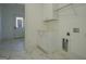Well-lit mudroom features built-in storage and durable tile floors, perfect for a busy Gathering at 5106 N Pratt St, Covington, GA 30014