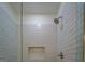 Elegant shower with glass door, chrome shower head and hardware, and built-in niche at 5106 N Pratt St, Covington, GA 30014