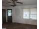 Room featuring a ceiling fan, a window, and an exterior door at 2802 Ocean Valley Dr, South Fulton, GA 30349