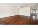 Cozy living room with hardwood floors, neutral paint, and access to additional rooms at 6517 Snowbird Ln, Douglasville, GA 30134
