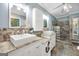 Modern bathroom with granite counters, double sinks, and a spacious stone and glass shower at 701 Mask Rd, Brooks, GA 30205