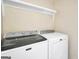 Well-equipped laundry area features modern Maytag washer and dryer units and a convenient storage shelf at 701 Mask Rd, Brooks, GA 30205