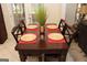 Cozy breakfast area with a table set for four, near the french doors leading to outdoor space at 305 Matthew Cir, Stockbridge, GA 30252
