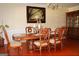 Elegant dining room boasts a decorative table with seating for six and rich hardwood floors at 305 Matthew Cir, Stockbridge, GA 30252