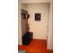 Inviting entryway featuring hardwood floors, coat rack with storage, and a decorative elephant wall hanging at 305 Matthew Cir, Stockbridge, GA 30252