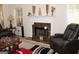 Relaxing living room featuring a marble fireplace, comfortable recliners, and decorative accents at 305 Matthew Cir, Stockbridge, GA 30252