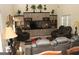 Spacious living room with vaulted ceilings, built-in shelving, and comfortable seating arrangement at 305 Matthew Cir, Stockbridge, GA 30252