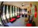 Relaxing screened porch with comfortable seating, ceiling fan, and open views at 305 Matthew Cir, Stockbridge, GA 30252