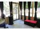 Enclosed screened porch with comfortable seating and outdoor heater at 305 Matthew Cir, Stockbridge, GA 30252