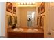 Bathroom featuring double sink vanity with warm lighting, and large mirror at 305 Matthew Cir, Stockbridge, GA 30281