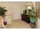 Second-floor hallway featuring neutral-toned walls, staircase with white railings, and tasteful decor at 305 Matthew Cir, Stockbridge, GA 30281