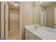 Bathroom features tiled floors, walk-in shower, and a neutral vanity at 1615 Clairmont Sw Ln, Conyers, GA 30094