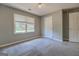 Neutral bedroom features carpet, closet, ceiling fan and a bright window at 1615 Clairmont Sw Ln, Conyers, GA 30094