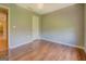 Bedroom with hardwood floors features overhead lighting and neutral paint at 1615 Clairmont Sw Ln, Conyers, GA 30094